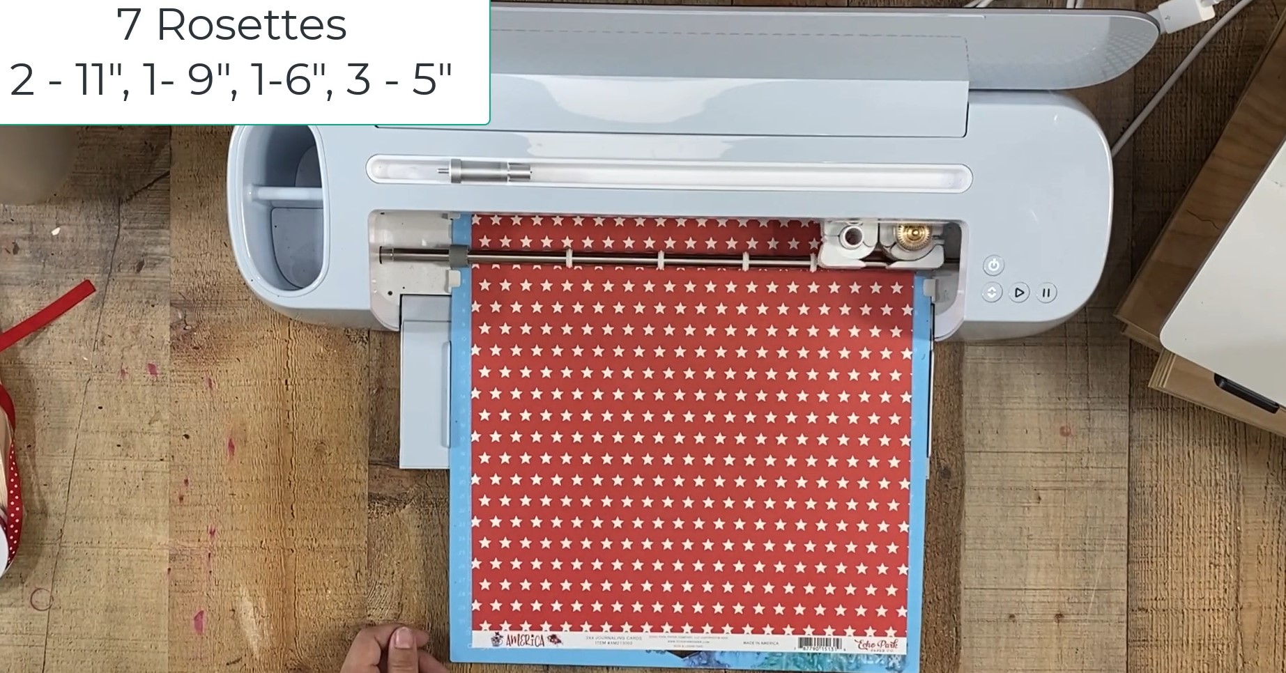 Red star paper on cutting board loaded into Cricut.