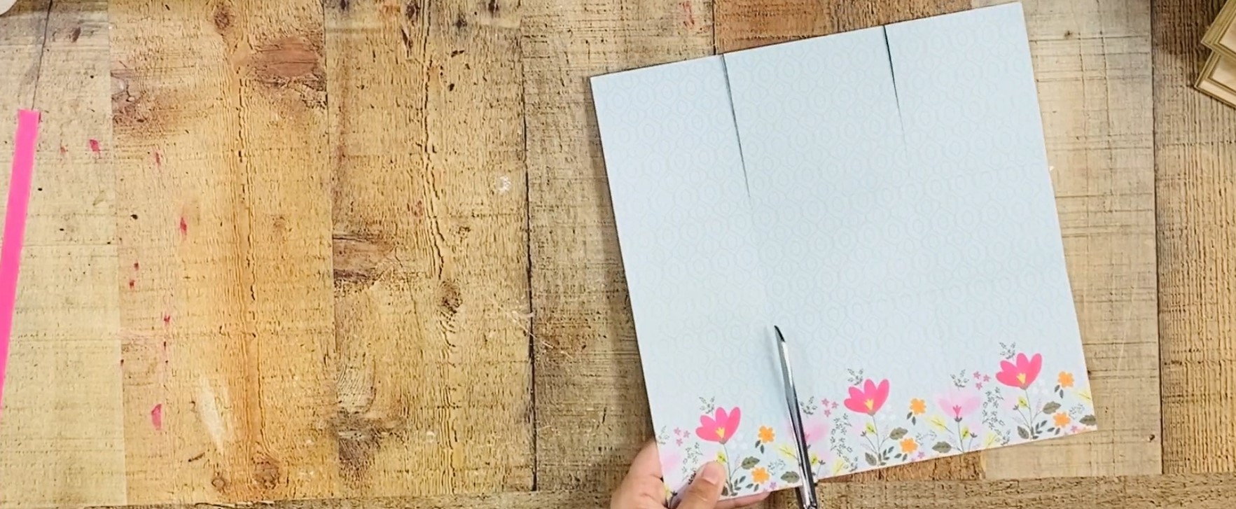 Cutting sections at the top and bottom of cardstock.