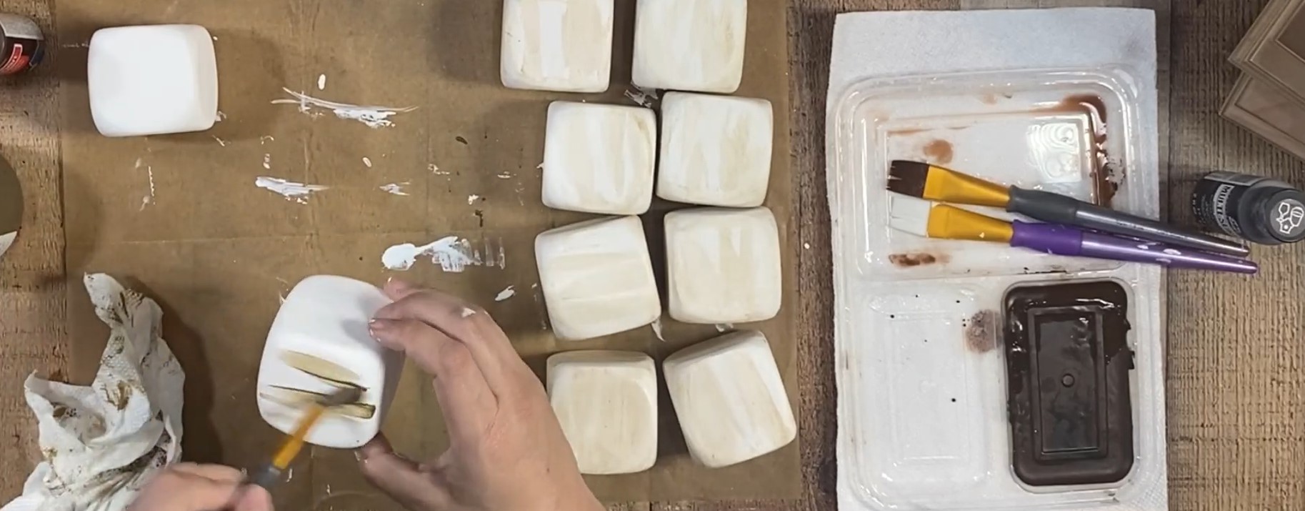 Brown stain added to white cubes. 